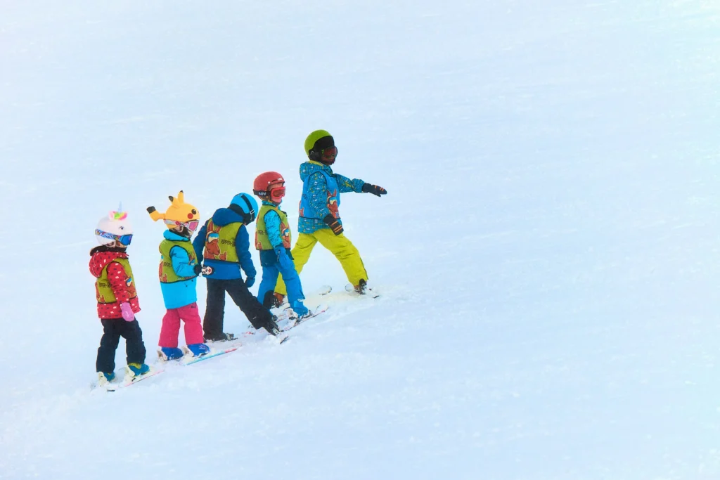 Nanny caring for children in the snow - Les Arcs | Little Peaks Nannies
